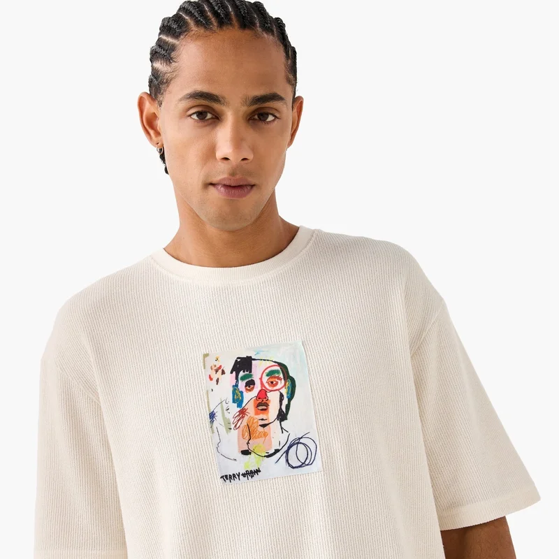 SP Characters Graphic Print Textured T-shirt with Round Neck